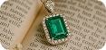 Emerald pendant on book
